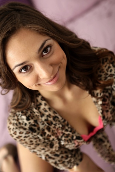 Lovely Latina Sara Luvv undresses in bed and slowly touches her cute muff