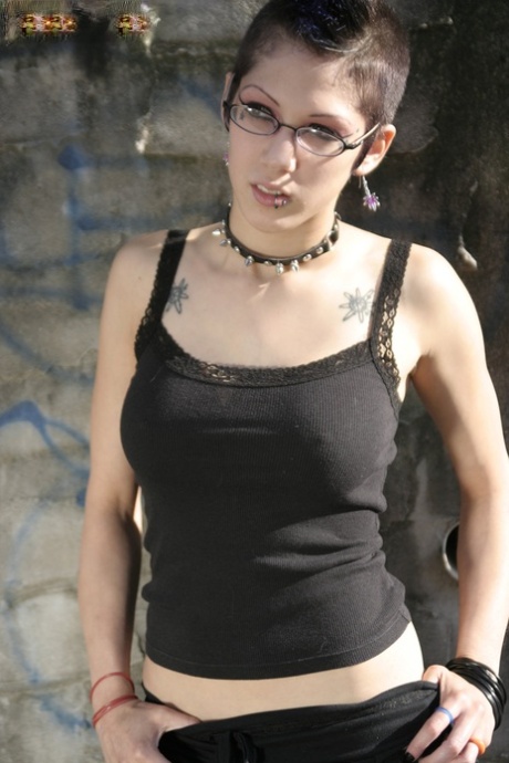 Gothic slut with sexy glasses Asphyxia flashes her ass and pussy outdoors