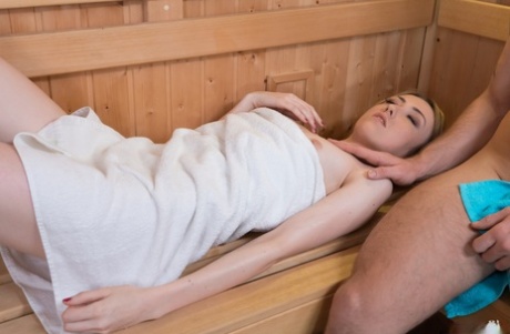 Teen hottie with a flat chest gets fucked by a large dick in the sauna