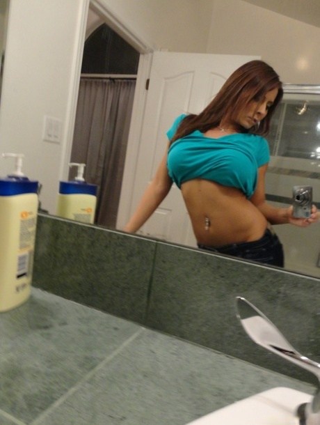 Brunette Madison Ivy takes sexy selfies and shows her big tits in the bathroom