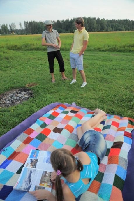 Alluring teen Oksana enjoying hardcore sex in an outdoor 3some with two studs