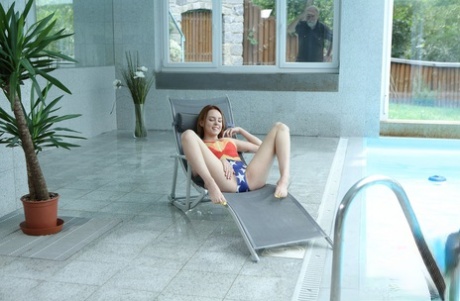 Sweet amateur with big tits Candy Red gets banged beside the indoor pool