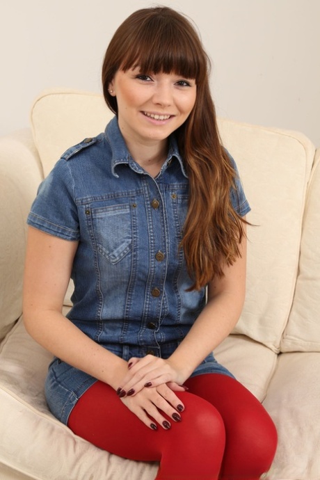 Brunette Helen G stripping off cute denim outfit and posing in pantyhose