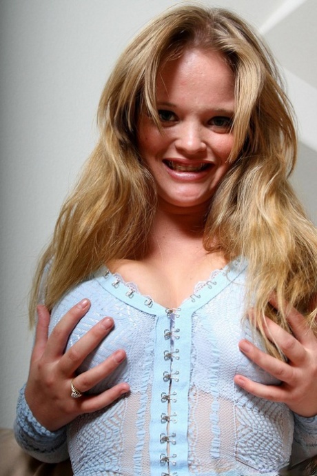 Chubby blonde babe Kissy shows her huge saggy naturals and poses topless