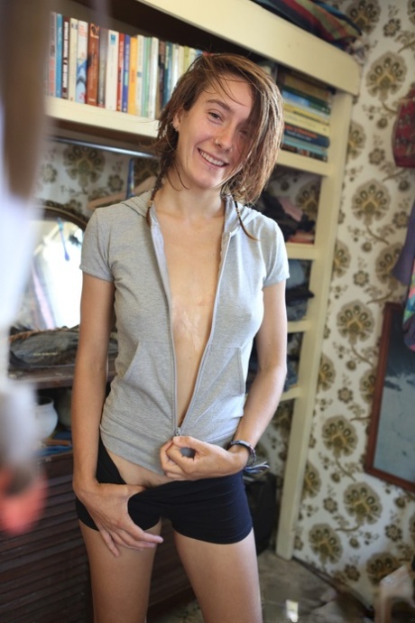 Slender teen gal with pierced nose Roe showing her small ass and hairy twat