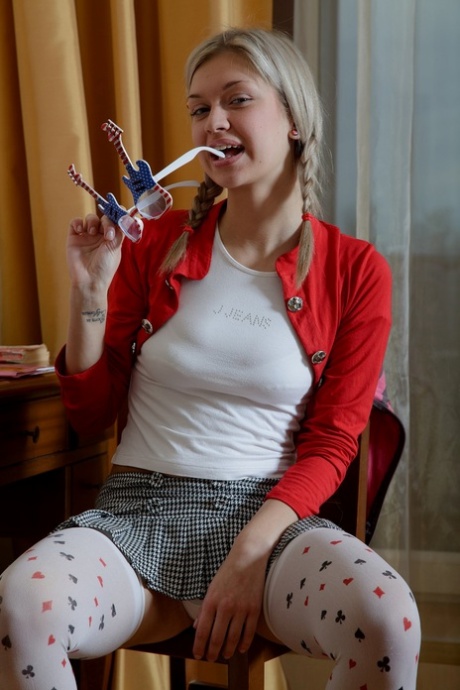 Skinny teen with pigtails Yuki rides a rubber dildo anally after stripping