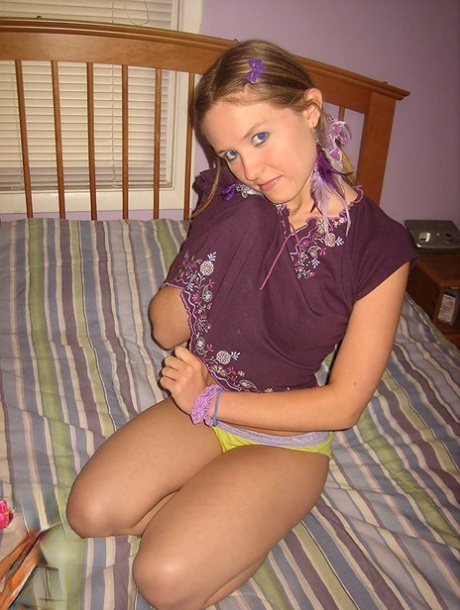 Cute brunette Kitty strips and toys herself after playing with Barbies