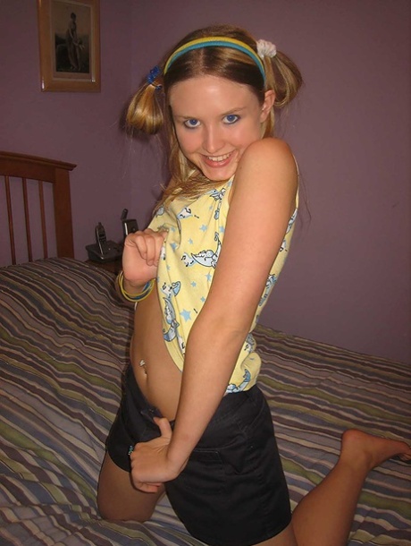 Lovely amateur teen Kitty strips naked & analizes herself with a dildo