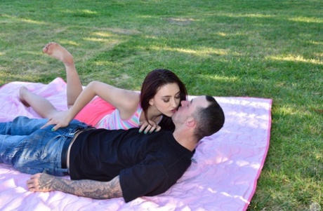 MILF Crissy Lyn and teen Mandy Muse give a deepthroat blowjob in the park