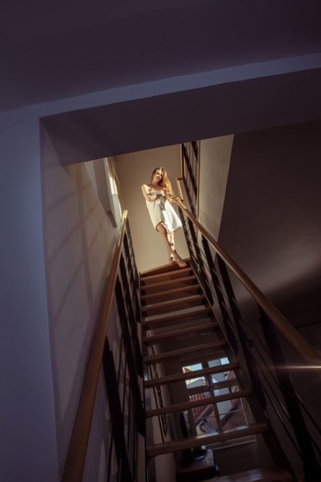 Sweet teen with small boobs Bretona reveals her twat & round ass on the stairs