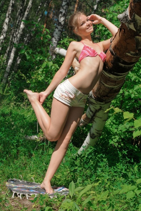 Cute teen Bridgit A shows off her beautiful body in a sexy outdoor striptease