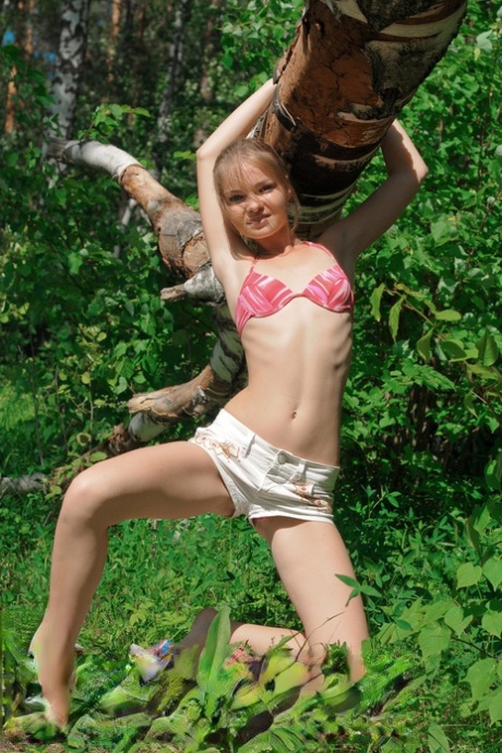 Cute teen Bridgit A shows off her beautiful body in a sexy outdoor striptease