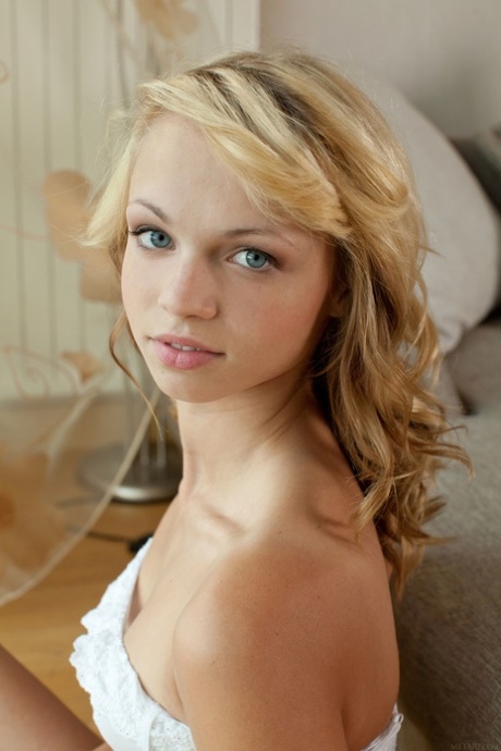 Alluring teen Eve B shows off her small tits and her lickable pussy