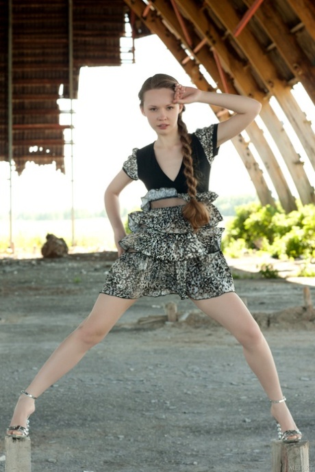 Russian teen Virginia Sun strips naked outdoors & reveals her slim body