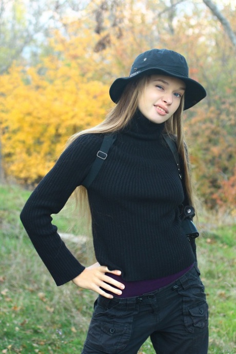 Adorable teen Milena D shows her slim figure and big tits in a solo