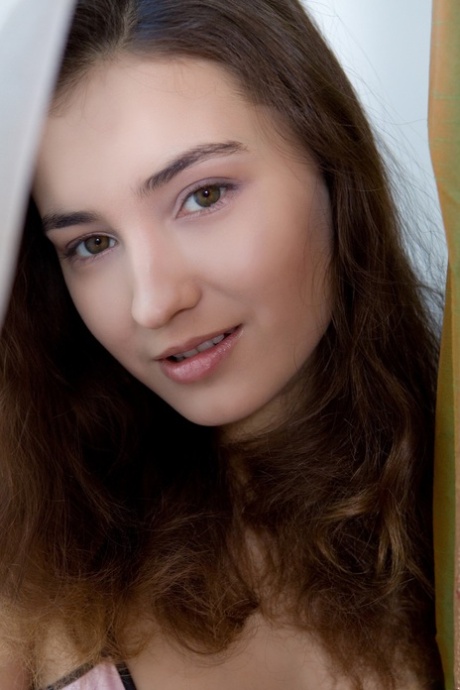Flexible teen Francine A undressing and spreading her furry pussy