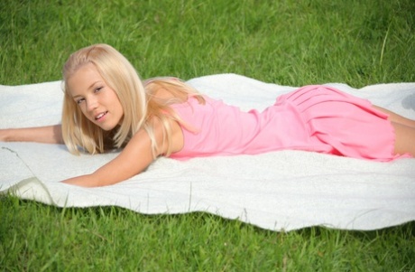 Glamorous teen babe Marina C strips naked & sunbaths at the picnic