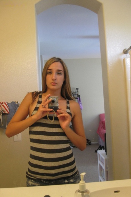 Sweet teen Jules Diamond flashes her twat and exposes her titties