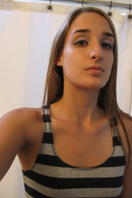 Sweet teen Jules Diamond flashes her twat and exposes her titties