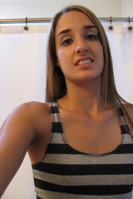 Sweet teen Jules Diamond flashes her twat and exposes her titties