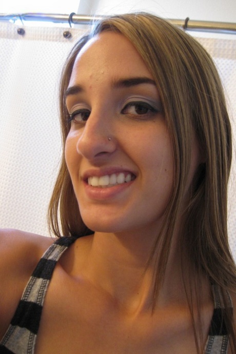 Sweet teen Jules Diamond flashes her twat and exposes her titties