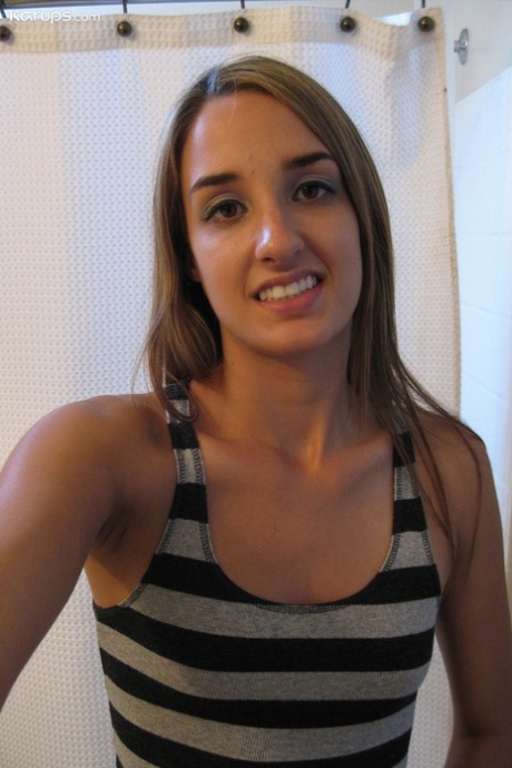 Sweet teen Jules Diamond flashes her twat and exposes her titties