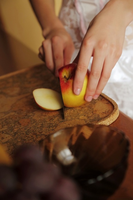 Glamorous teen babe Mila unveils her big boobs while making a fruit salad