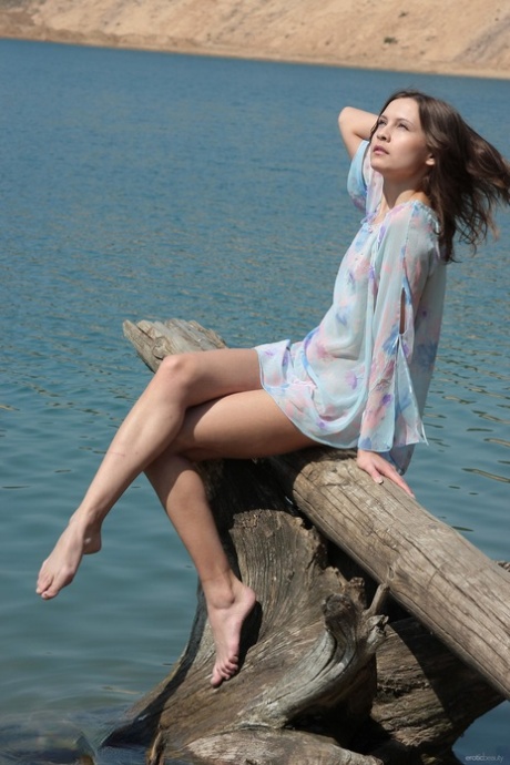 Alluring teen Lina G shows her small tits & her yummy pussy outdoors