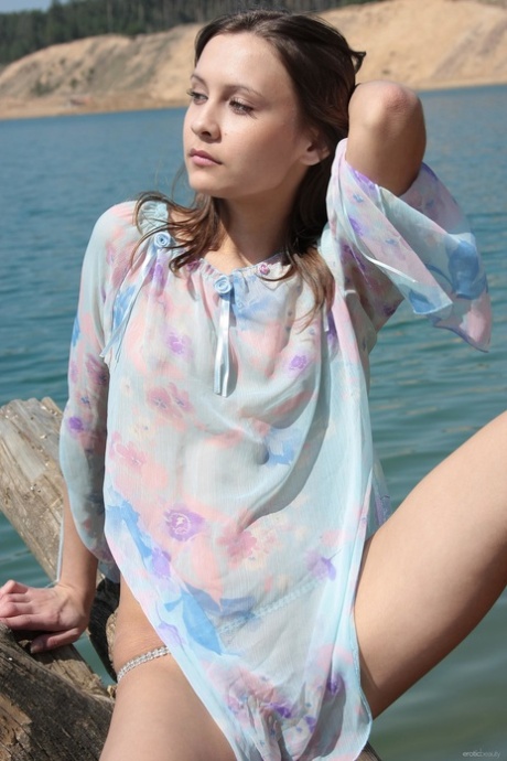 Alluring teen Lina G shows her small tits & her yummy pussy outdoors