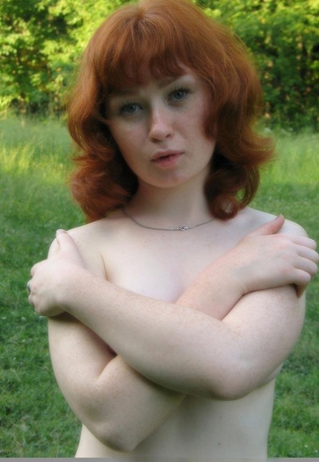 Amateur ginger teen with a big ass posing in beautiful nature butt naked