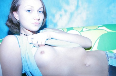 Shy teen Tanya shows her small tits while taking topless selfies with her BF