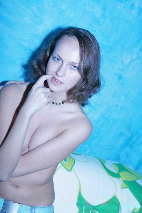 Shy teen Tanya shows her small tits while taking topless selfies with her BF