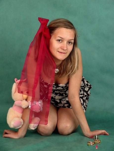 Cute amateur teen Marina strips & masturbates while posing with a stuffed toy