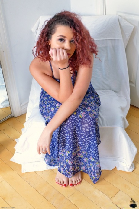 Curly haired Latina Adrian Black shows her killer ass and delicious feet