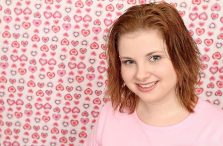 Young redhead Lil Candy shows her yummy pussy up close & toys with her dildo