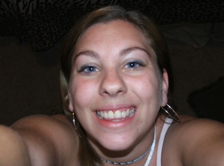 Chubby amateur shows her big breasts up close while taking nude selfies