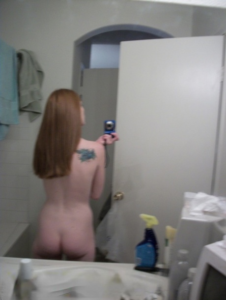 Ginger amateur Emily takes selfies of her naked teen body in the mirror