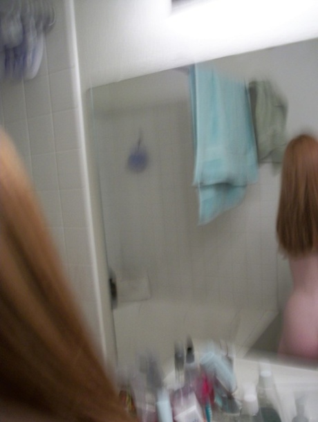 Ginger amateur Emily takes selfies of her naked teen body in the mirror