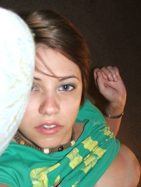 Beautiful short-haired amateur babe shows her big boobs in a solo