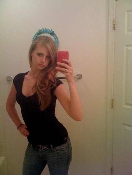 Slender college babe takes selfies of her sexy body and bald pussy
