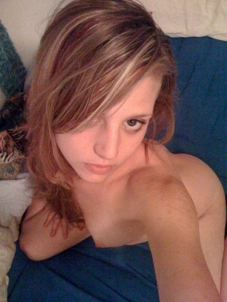 Slender college babe takes selfies of her sexy body and bald pussy