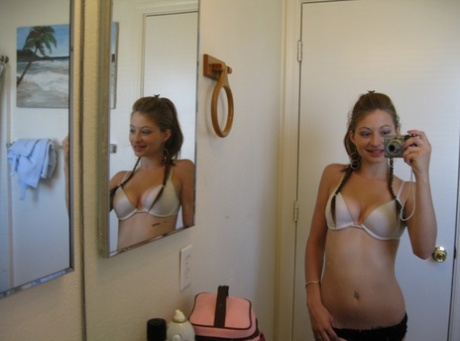 Playful amateur teen Dixie takes selfies in the mirror while posing sexily