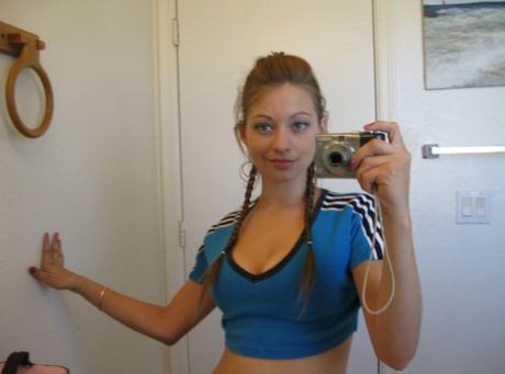 Playful amateur teen Dixie takes selfies in the mirror while posing sexily