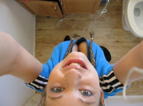 Playful amateur teen Dixie takes selfies in the mirror while posing sexily