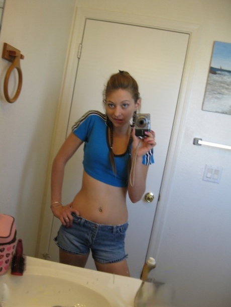 Playful amateur teen Dixie takes selfies in the mirror while posing sexily
