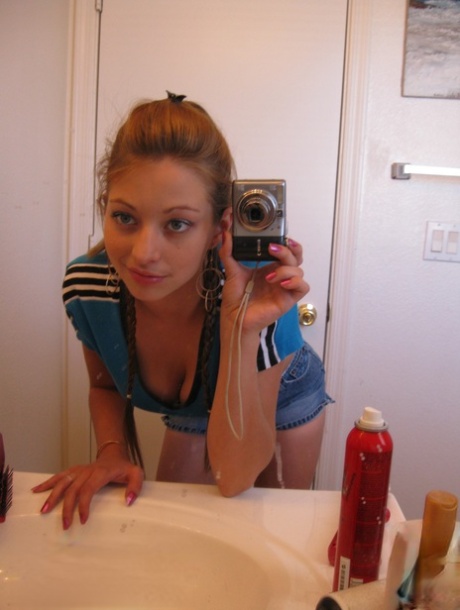Playful amateur teen Dixie takes selfies in the mirror while posing sexily