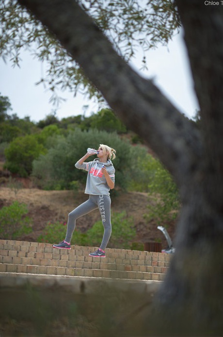 Tiny blonde teen Chloe works out in a hoodie & shows her small tits in public