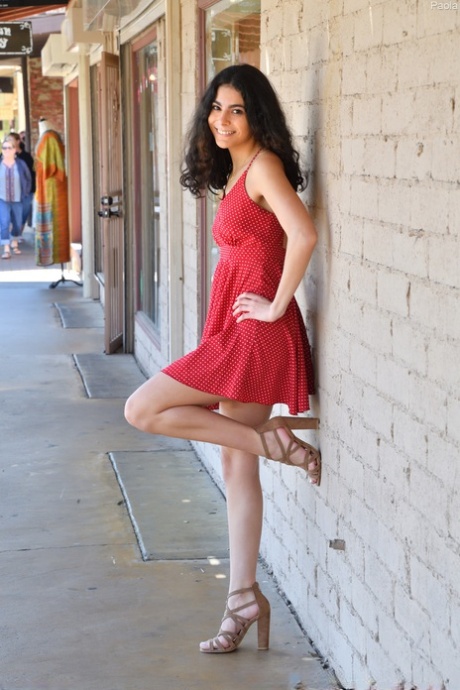 Charming babe Paola teases in a sexy dress & flashes a pantyless upskirt
