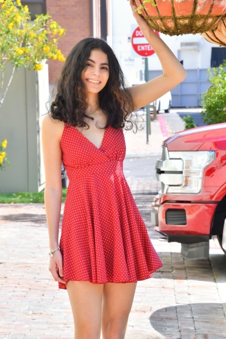 Charming babe Paola teases in a sexy dress & flashes a pantyless upskirt