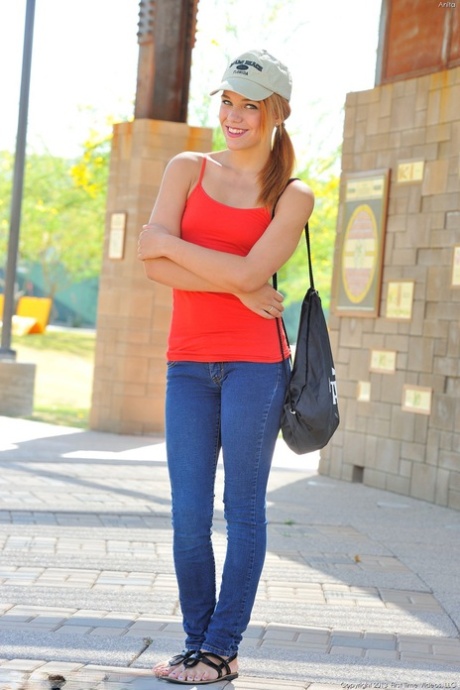 Skinny Anita slowly losing her outfit to pose nude in the middle of a road